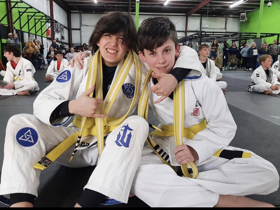 Two young Fusion Jiu Jitsu students together in their gis at a seminar